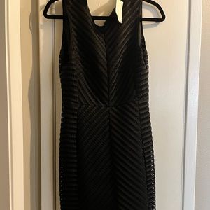 H&M black sleeveless dress, NWT size 8. Zips in the back